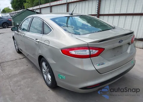 2015 Ford Fusion Energi Titanium from USA, damaged, VIN 3FA6P0SU3FR114739